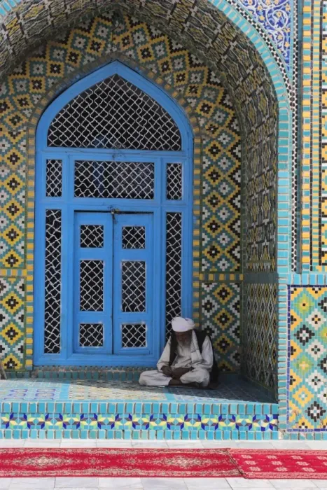 Framed Print : Pilgrim sits in a niche at the Shrine of Hazrat Ali, who was assassinated in 661 Framed Print : Pilgrim sits in a niche at the Shrine of Hazrat Ali, who was assassinated in 661