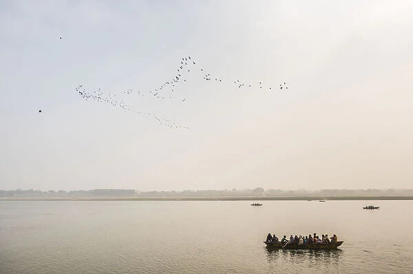Pilgrims on a boat on the River Ganges, Varanasi, Uttar Pradesh, India, Asia