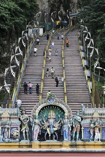Pilgrims and tourists walking up the steep steps to the Batu Caves, Gombak, Malaysia