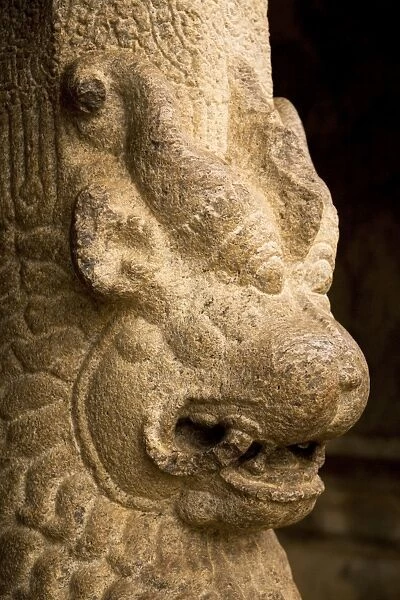 Detail from a pillar of one of the mandapams (or mandapas), rock-cut cave temples within the ancient site of Mahabalipuram (Mamallapuram), UNESCO World Heritage Site, Tamil Nadu
