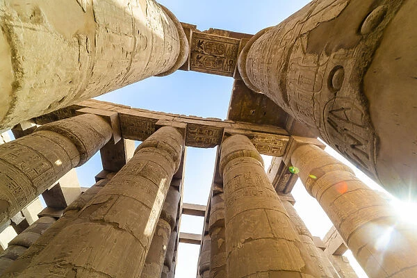 Pillars decorated with Hieroglyphics in the Great Hypostyle Hall at Karnak Temple