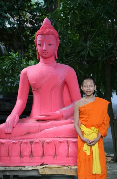 Framed Print : Pink Buddha and young monk at Wat Sene temple, Luang Prabang, Laos, Indochina Framed Print : Pink Buddha and young monk at Wat Sene temple, Luang Prabang, Laos, Indochina