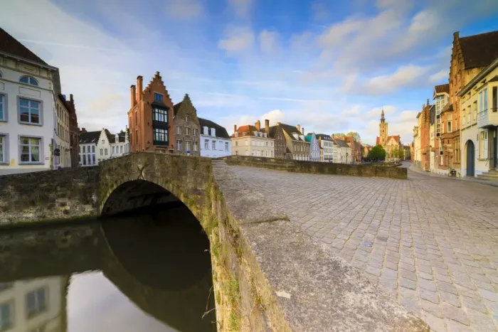 Framed Print : Pink clouds at dawn on the typical buildings and quay along the typical canal, Bruges