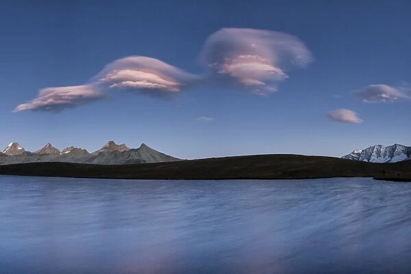 Pink clouds after sunset on Rosset Lake at an altitude of 2709 meters, Gran Paradiso National Park