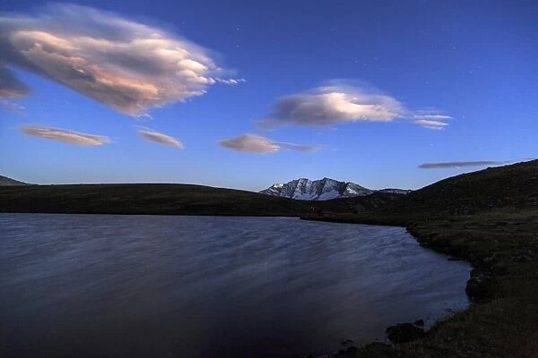 Pink clouds after sunset on Rossett Lake at an altitude of 2709 meters, Gran Paradiso National Park