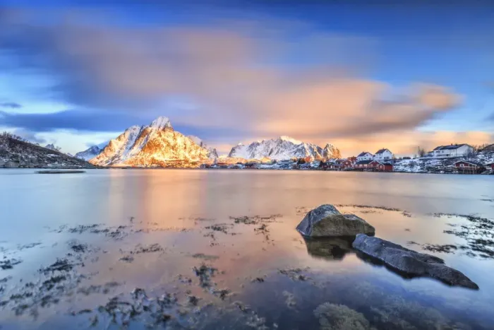 Framed Print : The pink sky at sunrise illuminates Reine village with its cold sea and snowy peaks Framed Print : The pink sky at sunrise illuminates Reine village with its cold sea and snowy peaks