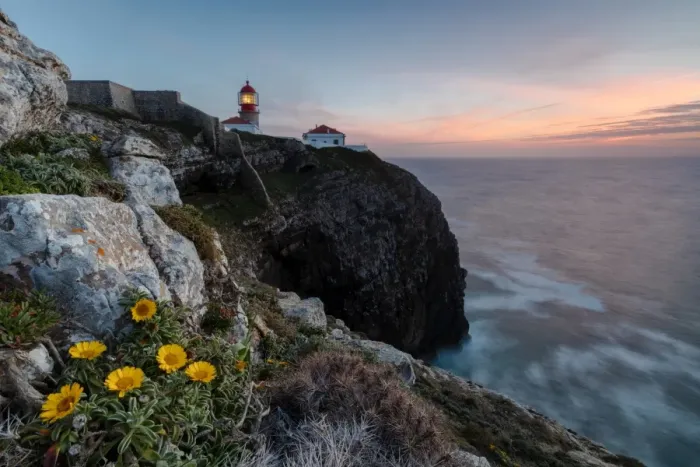 Framed Print : Pink sky at sunset and yellow flowers frame the lighthouse, Cabo De Sao Vicente, Sagres Framed Print : Pink sky at sunset and yellow flowers frame the lighthouse, Cabo De Sao Vicente, Sagres
