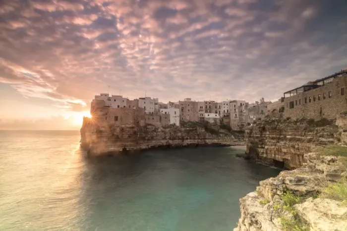 Framed Print : Pink sunrise on the turquoise sea framed by old town perched on the rocks, Polignano a Mare Framed Print : Pink sunrise on the turquoise sea framed by old town perched on the rocks, Polignano a Mare