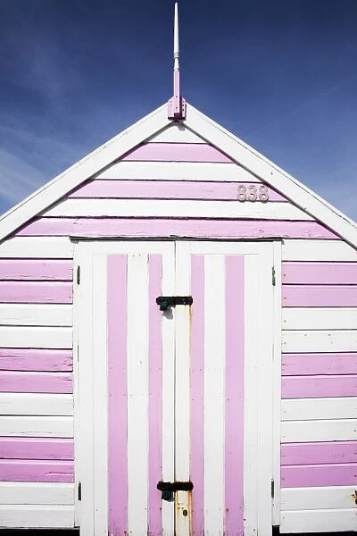 Pink and white striped beach hut, Felixstowe, Suffolk, England, United Kingdom, Europe