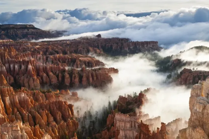 Framed Print : Pinnacles and hoodoos with fog extending into clouds of a partial temperature inversion, Bryce Canyon National Park, Utah, United States of America, North America