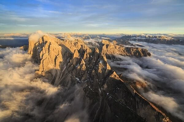 The pinnacles of the Odle Group (Geisler) emerging from the fog, Dolomites, South Tyrol, Italy, Europe