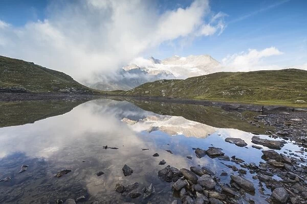 Piz Arlas, Cambrena, Caral reflected in lake, Bernina Pass, Poschiavo Valley, Engadine