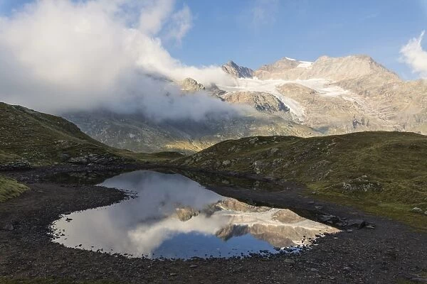 Piz Arlas, Cambrena, Caral reflected in water, Bernina Pass, Poschiavo Valley, Engadine
