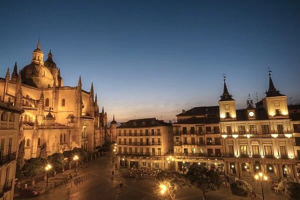 Plaza Mayor in the evening with the Cathedral on the left and Town Hall on the right)