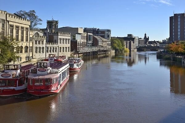 Pleasure boats on the River Ouse in front of the Guildhall, York, Yorkshire, England, United Kingdom, Europe