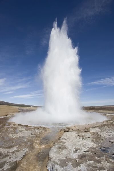 Plume of water and steam from the Strokkur Geysir exploding into the air at Geysir near Reykjavik