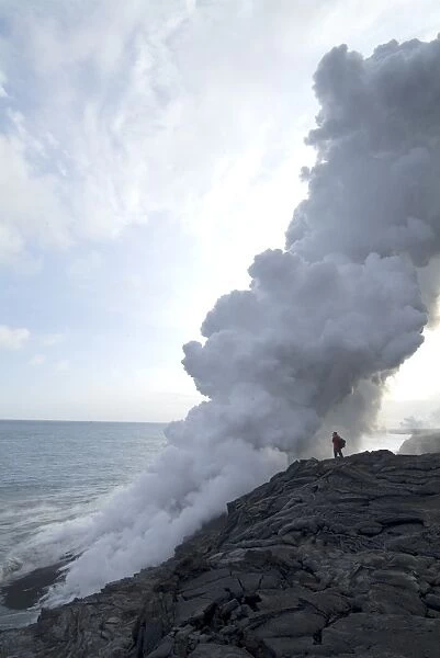Plumes of steam where the lava reaches the sea