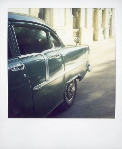 Polaroid of light reflecting in paintwork of classic American car, Havana