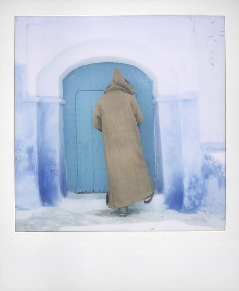 Polaroid of man wearing traditional woollen djellaba