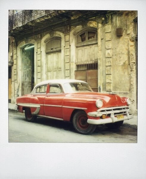 Polaroid of red classic American car parked on street, Havana, Cuba, West Indies