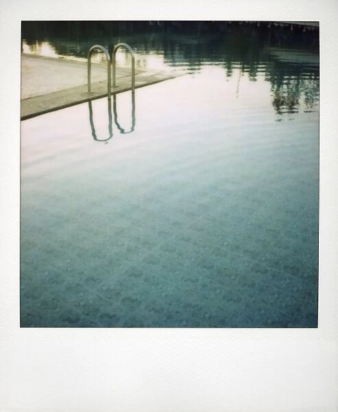 Polaroid of swimming pool with reflections
