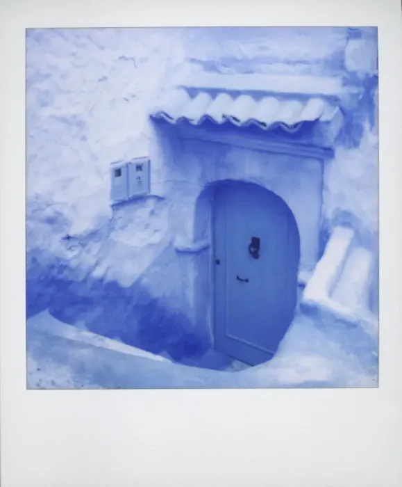 Framed Print : Polaroid of traditional painted blue door against bluewashed wall Framed Print : Polaroid of traditional painted blue door against bluewashed wall