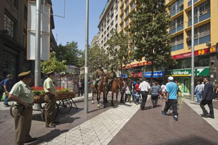Framed Print : Police on horseback and people on pedestrianised Paseo Huerfanos in the heart of the commercial centre, Santiago, Chile Framed Print : Police on horseback and people on pedestrianised Paseo Huerfanos in the heart of the commercial centre, Santiago, Chile