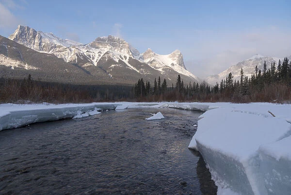 Policemans Creek in winter with Ha Ling Peak at sunrise, Bow Valley Provincial Park