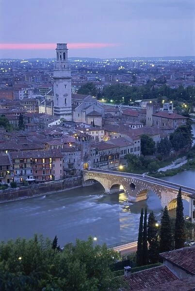 The Ponte Pietra and Anastasia Cathedral at dusk from