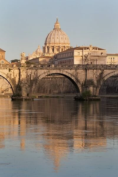 Ponte Sant Angelo bridge and St. Peters Basilica reflected in the River Tiber, Rome, Lazio, Italy, Europe