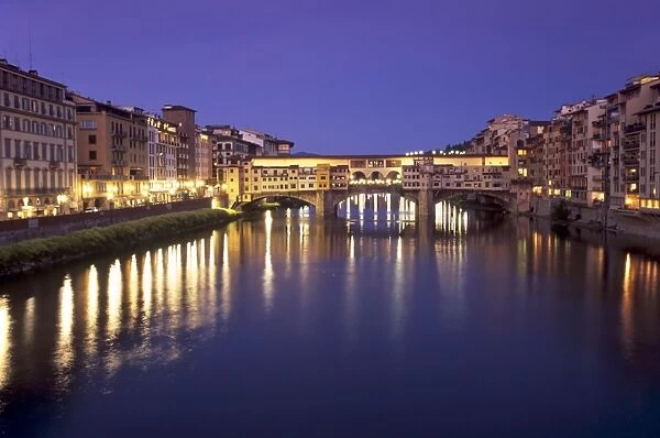 Ponte Vecchio (Old Bridge) over River Arno at dusk