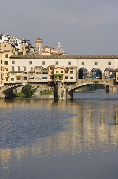 The Ponte Vecchio reflected in the river Arno in Florence, Tuscany, Italy