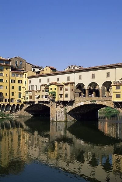 Ponte Vecchio reflected in the water of the Arno River