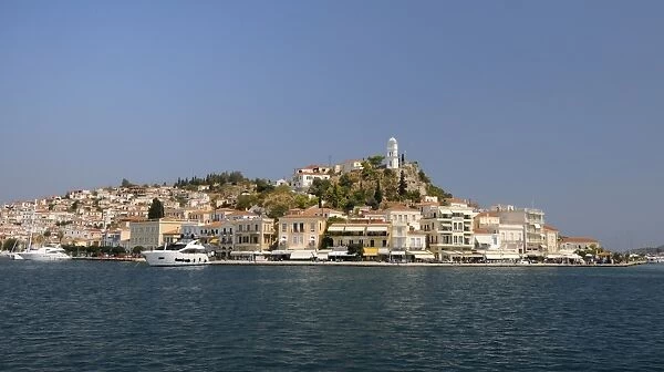 Poros town and harbour viewed from the sea, Poros island, Attica, Peloponnese, Greece