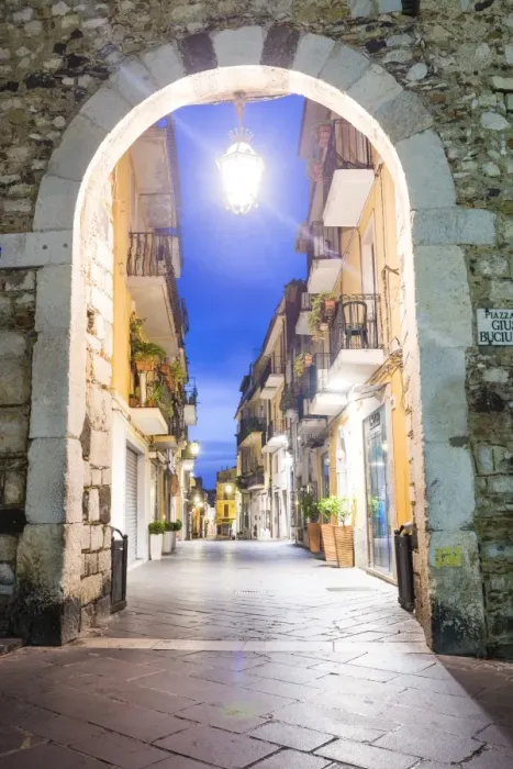 Framed Print : Porta Catania, one of the entrances to Corso Umberto, the main street in Taormina at night, Sicily, Italy, Europe Framed Print : Porta Catania, one of the entrances to Corso Umberto, the main street in Taormina at night, Sicily, Italy, Europe