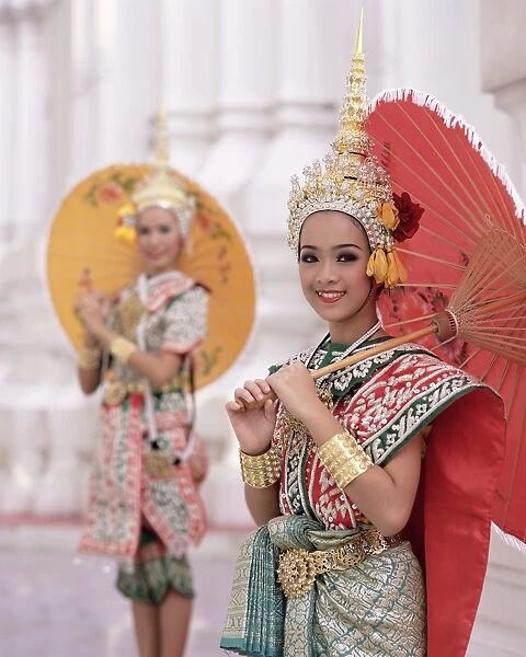 Portrait of two dancers in traditional Thai classical dance costume