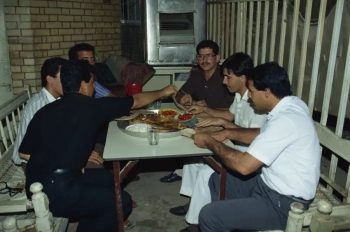 Framed Print : Portrait of a group of men friends enjoying meal of Mazgouf Framed Print : Portrait of a group of men friends enjoying meal of Mazgouf