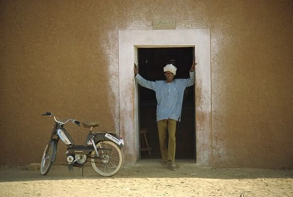 Portrait of man standing in doorway, Niger, Africa