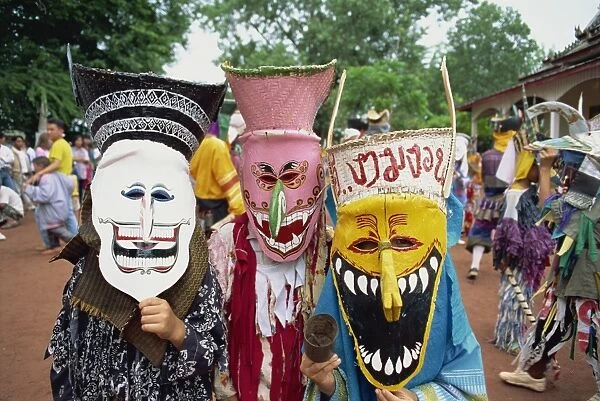 Portrait of people wearing masks of ghosts in the temple