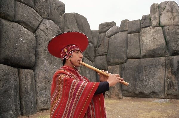 Portrait of a Peruvian man playing a flute