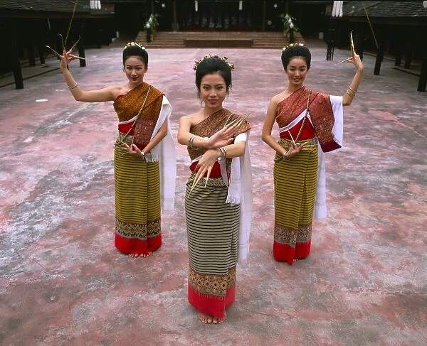 Portrait of three women in traditional Thai costume