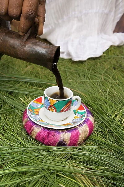 Pouring coffee during a coffee ceremony, Ethiopia, Africa