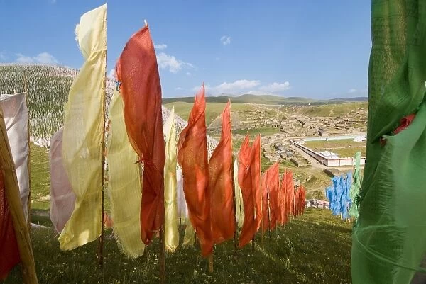 Prayer flags on hillside, Tagong Grasslands, Sichuan, China, Asia