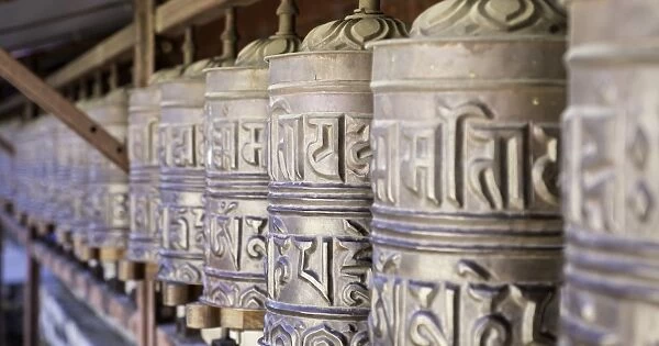 Prayer wheels at the Buddhist monastery in Tengboche in the Khumbu region of Nepal, Asia
