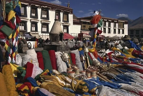 Prayer wheels and flags for sale in the Barkor market in Lhasa, Tibet, China, Asia