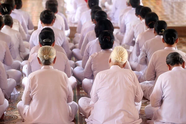 Praying devout women, ceremonial midday prayer, Cao Dai Holy See Temple, Tay Ninh