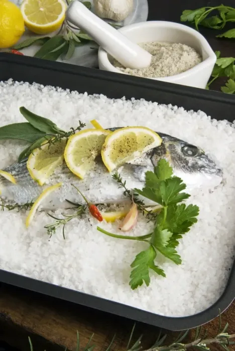 Framed Print : Preparing gilthead bream in salt coating Framed Print : Preparing gilthead bream in salt coating