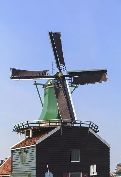 Preserved historic windmills and houses in Zaanse Schans, a village and working museum on the banks of the river Zaan, near Amsterdam, Zaandam, North Holland, Netherlands, Europe