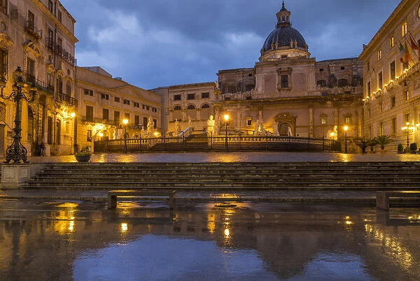 Pretoria Square and Cupula of the Santa Caterina d Alessandria Church reflected in a puddle