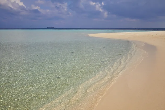 Framed Print : Pristine shallow waters lap against the white coral sand of a tropical beach; Havodda Island, Gaafu Dhaalu atoll, Maldives Framed Print : Pristine shallow waters lap against the white coral sand of a tropical beach; Havodda Island, Gaafu Dhaalu atoll, Maldives